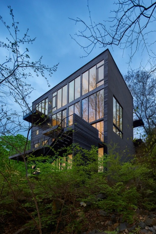 Modern architectural residence surrounded by trees